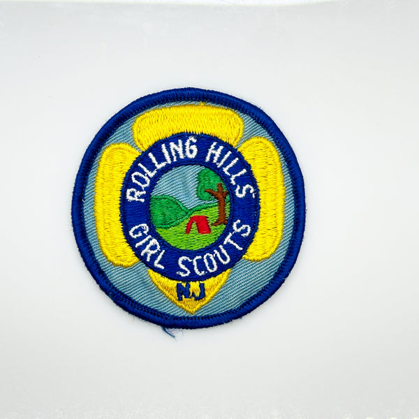 Girl Scouts patch with 'Rolling Hills Girl Scouts' text on a white background