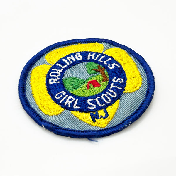 Girl Scouts patch with 'Rolling Hills Girl Scouts' text on a white background