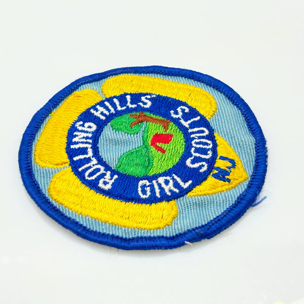 Girl Scouts patch with 'Rolling Hills Girl Scouts' text on a white background