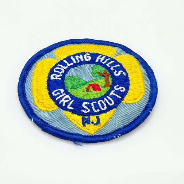 Girl Scouts patch with 'Rolling Hills Girl Scouts' text on a white background