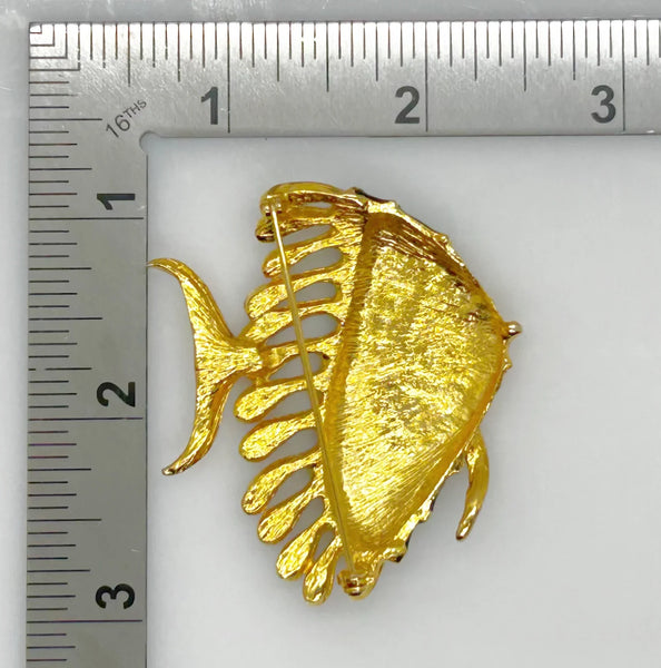 This charming angel fish brooch is a work of art with its vibrant blue and green enamel on a golden backdrop. His vibrant green eye will see all of the compliments you'll receive.