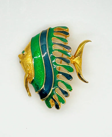 This charming angel fish brooch is a work of art with its vibrant blue and green enamel on a golden backdrop. His vibrant green eye will see all of the compliments you'll receive.