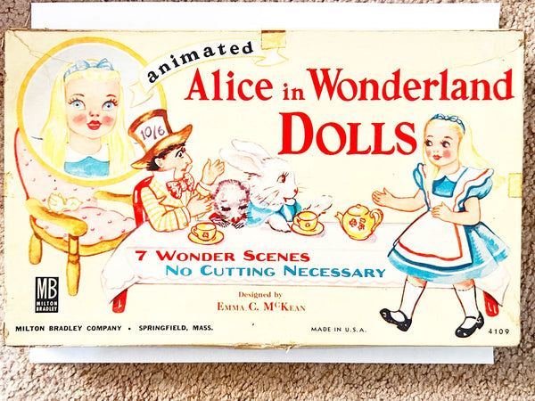 This is a vintage boxed set of "Animated Alice in Wonderland Dolls" paper dolls manufactured by the Milton Bradley Company. The set, number 4109, was designed by Emma C. McKean and includes seven scene cards where the dolls can be inserted into die-cut slits to "animate" the scenes.