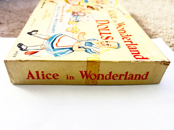 This is a vintage boxed set of "Animated Alice in Wonderland Dolls" paper dolls manufactured by the Milton Bradley Company. The set, number 4109, was designed by Emma C. McKean and includes seven scene cards where the dolls can be inserted into die-cut slits to "animate" the scenes.