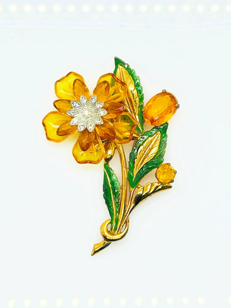 Perfect for vintage jewelry lovers: our Statement 4" Vintage Butterscotch Floral Brooch provides bold elegance with amber colored petals and sparkling rhinestone centers. Shop today!