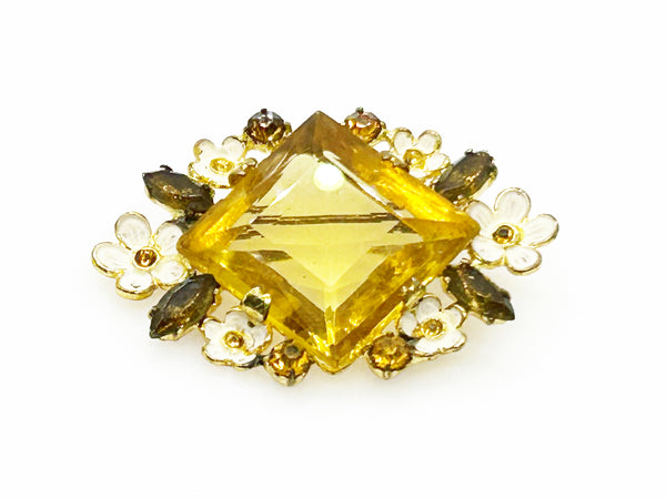 Perfect for vintage jewelry lovers: our Antique Clear Yellow Stone Floral Czech Brooch provides timeless elegance with enameled flowers and a clear center stone. Shop today!