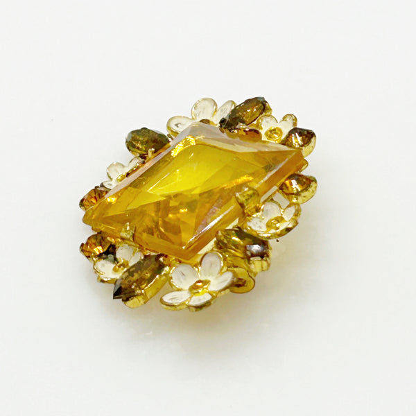 Perfect for vintage jewelry lovers: our Antique Clear Yellow Stone Floral Czech Brooch provides timeless elegance with enameled flowers and a clear center stone. Shop today!