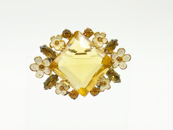 Perfect for vintage jewelry lovers: our Antique Clear Yellow Stone Floral Czech Brooch provides timeless elegance with enameled flowers and a clear center stone. Shop today!