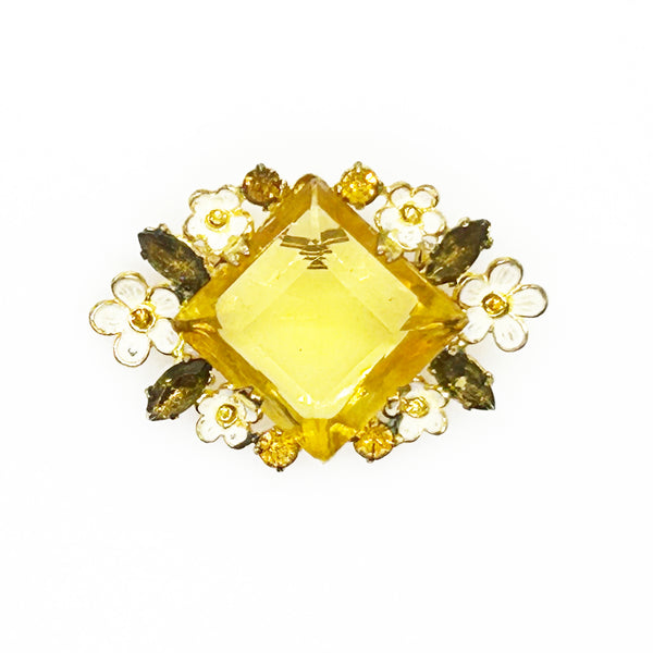 Perfect for vintage jewelry lovers: our Antique Clear Yellow Stone Floral Czech Brooch provides timeless elegance with enameled flowers and a clear center stone. Shop today!
