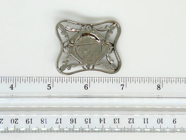 Perfect for vintage Avon enthusiasts: our Bold and Classic Medieval Style Pin with Purple Stone provides timeless elegance and bold sophistication. Shop today!