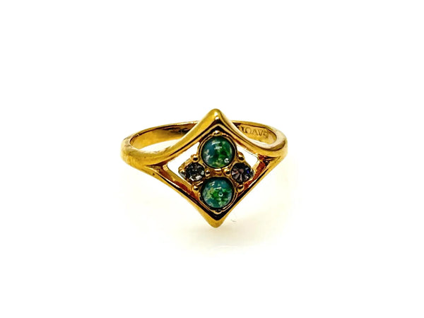 Here's a captivating description for our vintage Avon ring: Discover the charm of this exquisite Avon ring, a delightful piece from 1984, originating from the iconic "Glowing Sparkles" collection. 