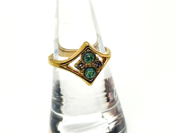 Here's a captivating description for our vintage Avon ring: Discover the charm of this exquisite Avon ring, a delightful piece from 1984, originating from the iconic "Glowing Sparkles" collection. 