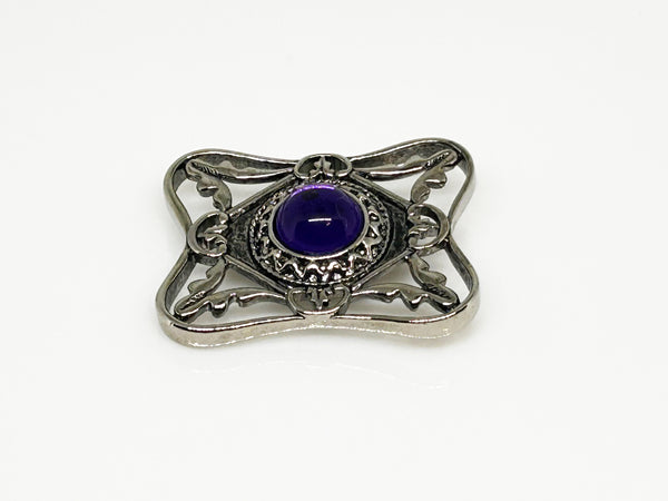 Perfect for vintage Avon enthusiasts: our Bold and Classic Medieval Style Pin with Purple Stone provides timeless elegance and bold sophistication. Shop today!