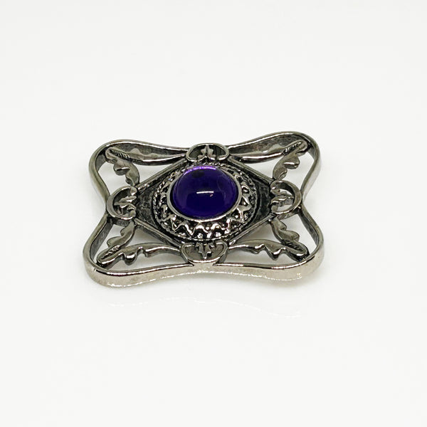 Perfect for vintage Avon enthusiasts: our Bold and Classic Medieval Style Pin with Purple Stone provides timeless elegance and bold sophistication. Shop today!