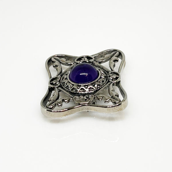 Perfect for vintage Avon enthusiasts: our Bold and Classic Medieval Style Pin with Purple Stone provides timeless elegance and bold sophistication. Shop today!