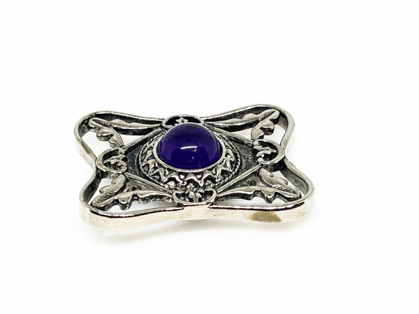 Perfect for vintage Avon enthusiasts: our Bold and Classic Medieval Style Pin with Purple Stone provides timeless elegance and bold sophistication. Shop today!