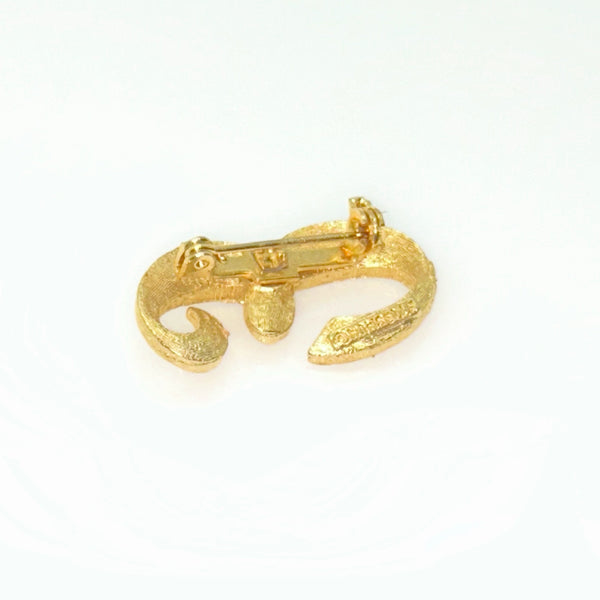 A small, vintage gold-tone initial "E" cursive monogram brooch pin, featuring a dual-textured finish with brushed matte styling and diamond-cut highlights on a plain white background