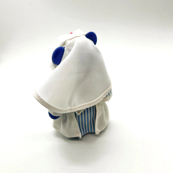 A small plush toy or stuffed animal shown from the back