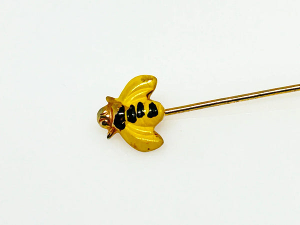 This charming vintage stick pin features a delightful black and gold bee design. The pin measures 1.75” in length, making it a perfect accessory to add a touch of whimsy to any outfit.