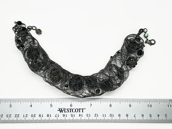 Black woven wire with stones necklace and adjustable fit for unique edgy style and bold elegance. The artistry and stunning appearance will make it a favorite. 