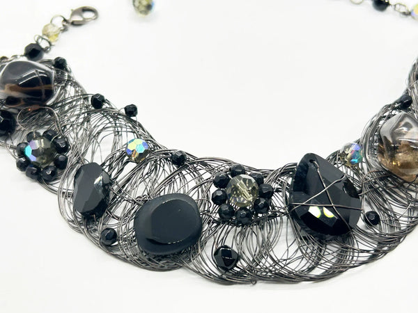 Black woven wire with stones necklace and adjustable fit for unique edgy style and bold elegance. The artistry and stunning appearance will make it a favorite. 
