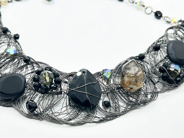 Black woven wire with stones necklace and adjustable fit for unique edgy style and bold elegance. The artistry and stunning appearance will make it a favorite. 