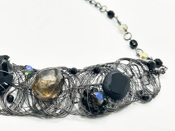 Black woven wire with stones necklace and adjustable fit for unique edgy style and bold elegance. The artistry and stunning appearance will make it a favorite. 