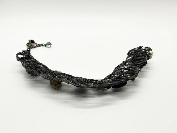 Black woven wire with stones necklace and adjustable fit for unique edgy style and bold elegance. The artistry and stunning appearance will make it a favorite. 