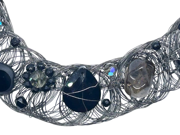 Black woven wire with stones necklace and adjustable fit for unique edgy style and bold elegance. The artistry and stunning appearance will make it a favorite. 