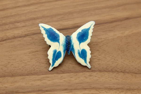 Perfect for collectors and vintage lovers: our Vintage Porcelain Blue and Cream Butterfly Brooch provides a hand-painted, unique enamel design. Shop today!