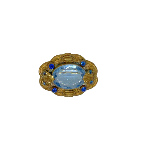 Beautiful Pale Blue Old World Brooch - Features intricate vintage craftsmanship with detailed metal and multiple shimmering blue stones. Shop now!