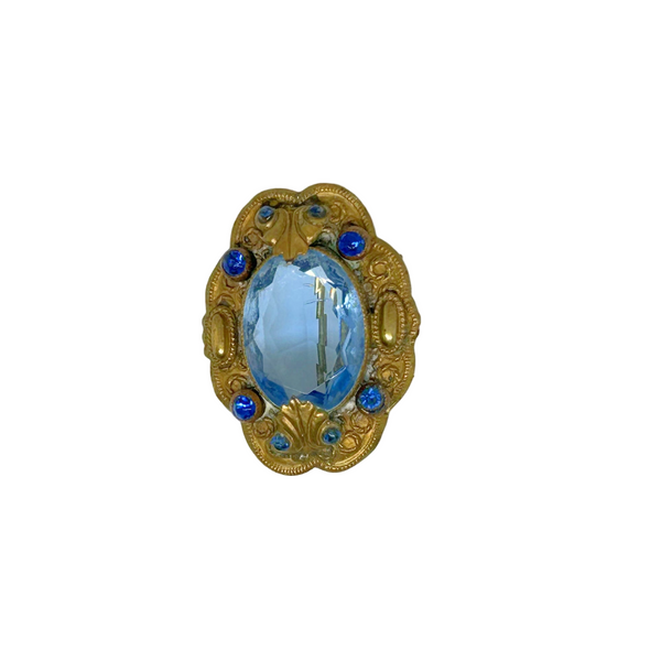 Beautiful Pale Blue Old World Brooch - Features intricate vintage craftsmanship with detailed metal and multiple shimmering blue stones. Shop now!