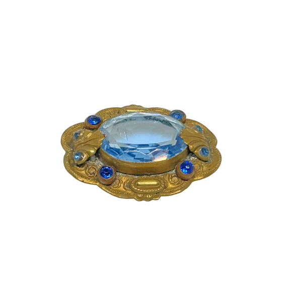 Beautiful Pale Blue Old World Brooch - Features intricate vintage craftsmanship with detailed metal and multiple shimmering blue stones. Shop now!