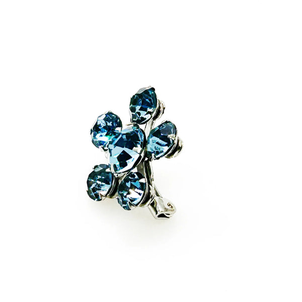 Measuring a delicate .75" across, this piece radiates timeless elegance. The unforgettable, eye-catching blue hue is beautifully complemented by the subtle "Coro" script signature discreetly placed on the back of the piece, adding a touch of authenticity and sophistication to this charming vintage treasure.