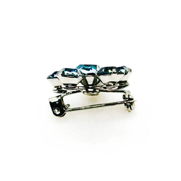 Measuring a delicate .75" across, this piece radiates timeless elegance. The unforgettable, eye-catching blue hue is beautifully complemented by the subtle "Coro" script signature discreetly placed on the back of the piece, adding a touch of authenticity and sophistication to this charming vintage treasure.