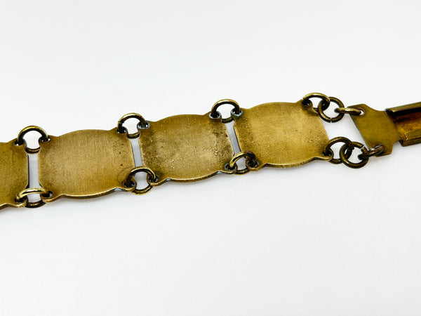 Perfect for vintage jewelry lovers: our Vintage French Souvenir Panel Bracelet provides a stunning display of French heraldic crests. Shop today!