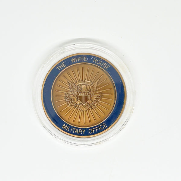 bronze-colored White House Military Office Challenge Coin. It features an image of the White House surrounded by the names of the five military branches: Army, Navy, Air Force, Marine Corps, and Coast Guard.