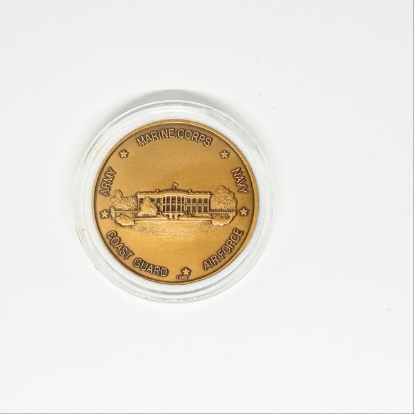 bronze-colored White House Military Office Challenge Coin. It features an image of the White House surrounded by the names of the five military branches: Army, Navy, Air Force, Marine Corps, and Coast Guard.