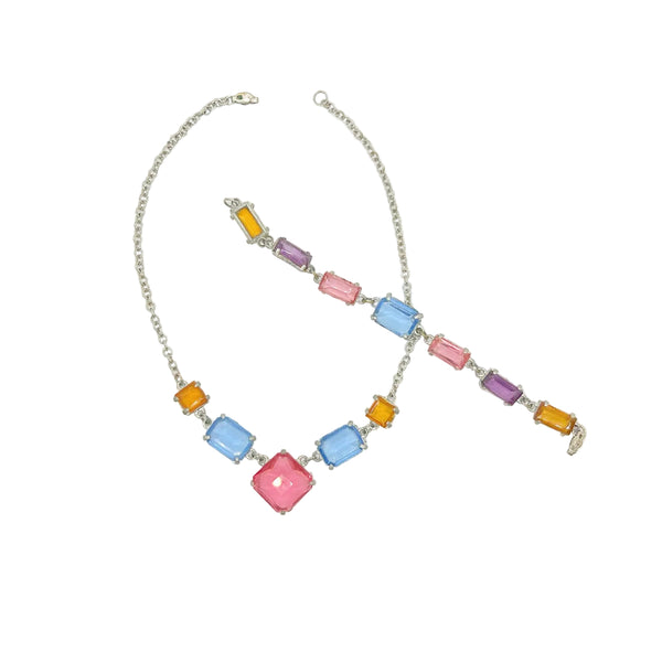 A silver-tone chain necklace and matching bracelet set featuring colorful rectangular and square gemstones in light blue, pink, purple, and orange on a plain white background.