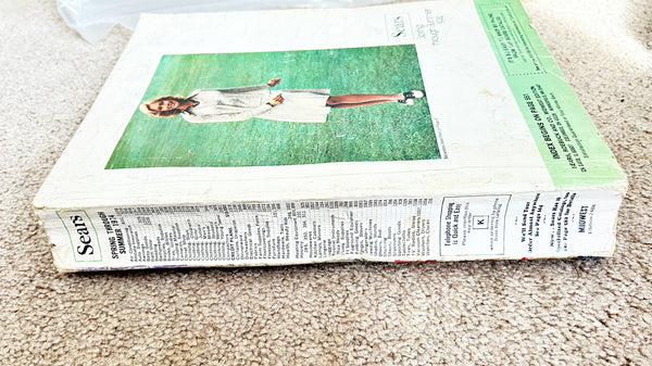 (Detail of condition) - Buckle up for a wild ride through 1974 with this gloriously thick Sears catalog—all 1427 pages of it! 