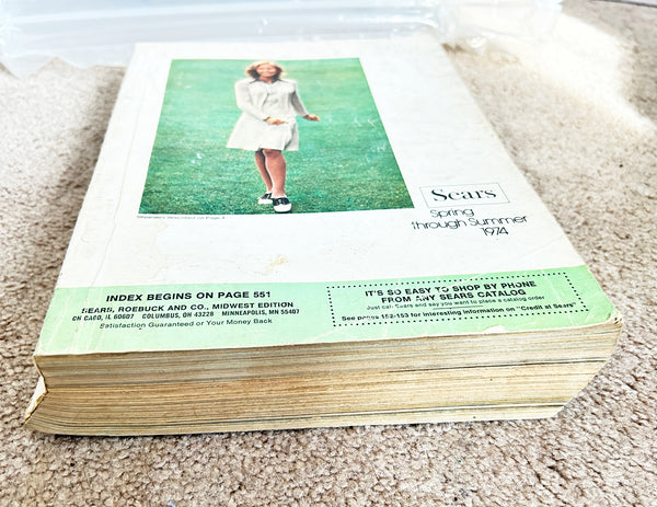 (Detail of condition) - Buckle up for a wild ride through 1974 with this gloriously thick Sears catalog—all 1427 pages of it! 