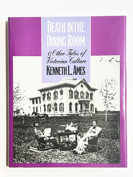 Front cover of the hardcover book "Death in the Dining Room and Other Tales of Victorian Culture" by Kenneth L. Ames, featuring a purple border and a vintage black-and-white photograph of a Victorian family seated on a lawn outside a large estate