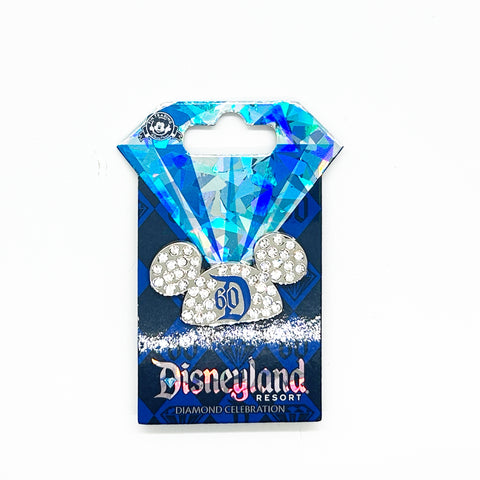Celebrate a milestone moment with this stunning official Disney trading pin from the iconic 2015 Diamond Celebration collection. Featuring Mickey's signature ears adorned with sparkling crystal rhinestones, this collectible captures the magic of Disneyland's 60th anniversary in elegant style. 