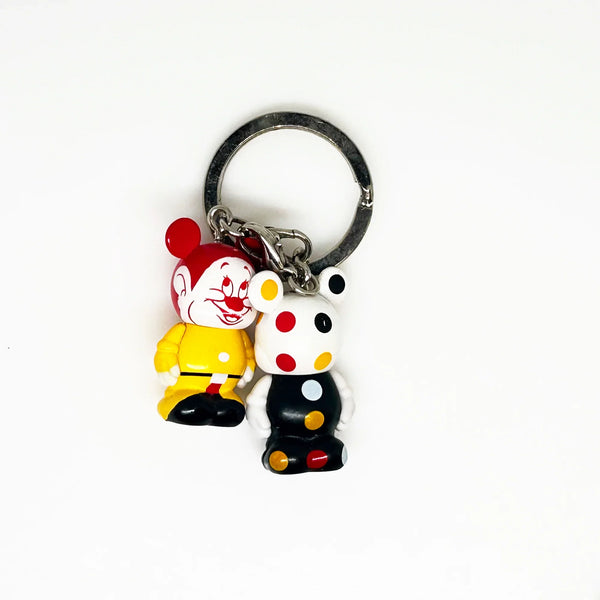 Dopey, from Snow White and the Seven Dwarves;appears as a clown themed Vinylmation Jr.stylized version of himself with a Mickey theme, along with a polka-dotted version.