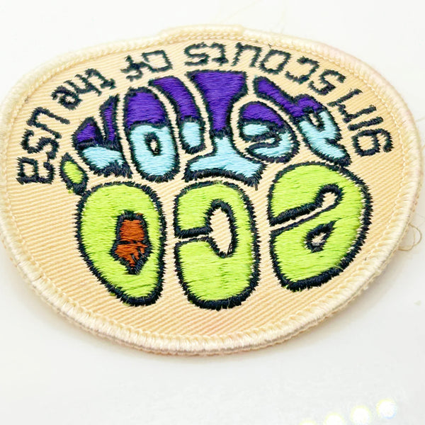 The patch was designed to symbolize the Girl Scouts' commitment to ecology and environmental conservation. Girls could earn the badge by participating in activities related to conservation, recycling, nature education, and taking action on local environmental issues. The "Eco Action" badge is now a retired patch and is considered a collectible item.