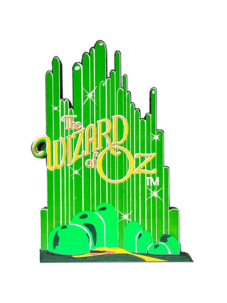 Bring a touch of classic Hollywood magic to your collection with this charming wooden Emerald City shelf sitter from Sheila's Collectibles. Crafted in the 1990s, this iconic piece captures the whimsical green spires of Oz in meticulous detail, complete with "The Wizard of Oz" branding.