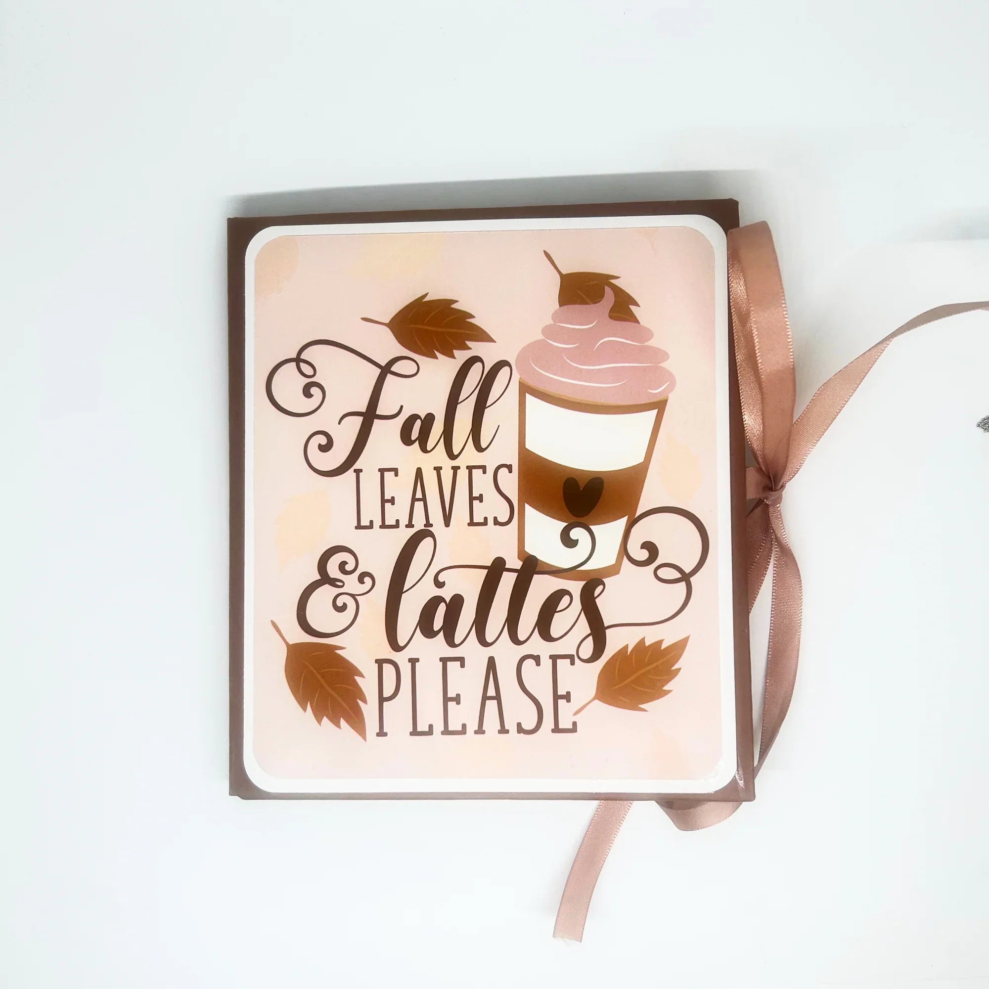 This charming album showcases autumn leaves, seasonal flowers, and delightful illustrations of warm drinks. Centered around family, home, fall, and coffee, it includes dedicated spaces for your personal notes and mementos, allowing you to customize it easily.