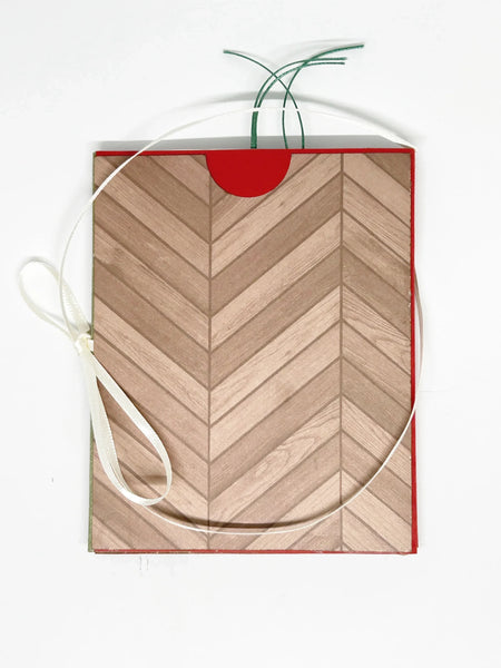 This one-of-a-kind handmade mini album captures the essence of fall – the most wonderful season! Showcasing rich shades of pumpkin, loden green, and cinnamon, it measures 4.75" tall by 3.75" wide and is secured with a soft off-white ribbon. 