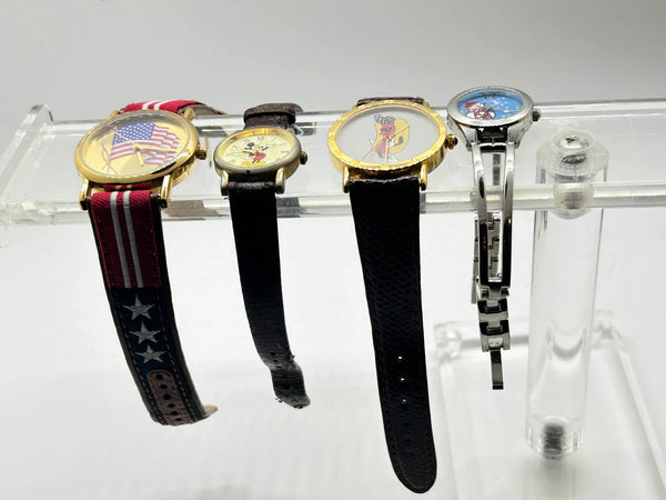 This is a group of four ladies' watches featuring graphic designs - an American flag, Mickey Mouse, a hot dog and a snowman. I don't know if any work, or just require batteries or can be repaired.  The lot would also provide parts for other watches or even craft projects. They are untested.