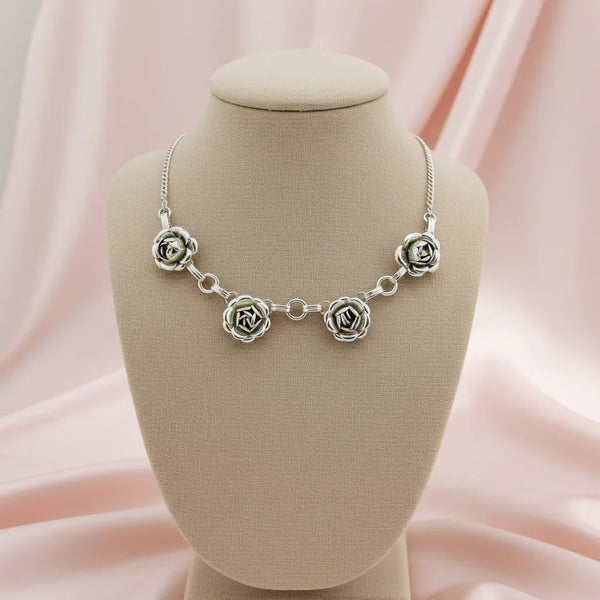 Perfect for vintage jewelry lovers: our Vintage Pretty Silver Tone Rose Necklace provides timeless elegance with delicately crafted rose details. Shop today
